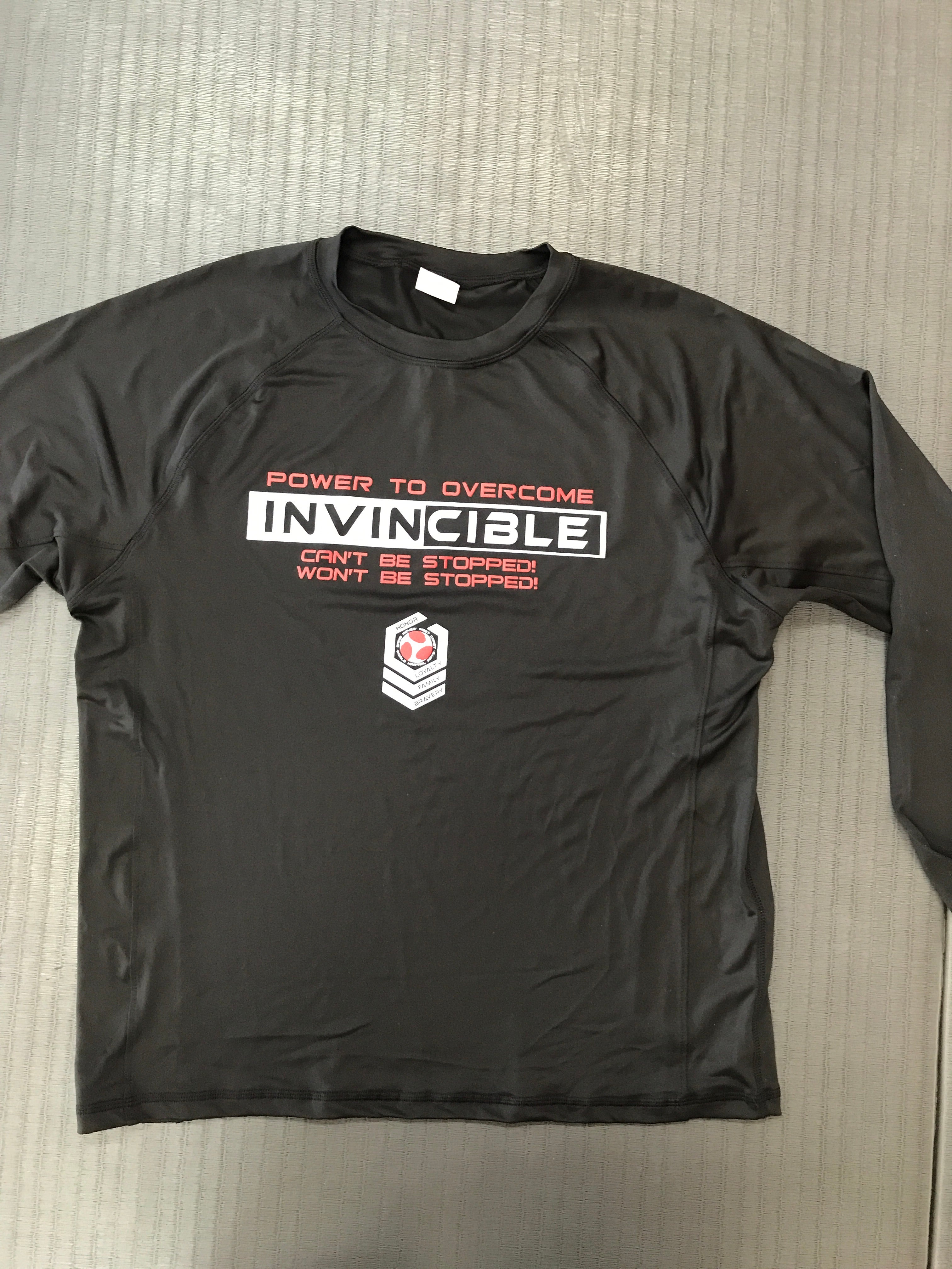 Invincible Rash Guard – Flying Sidekicks